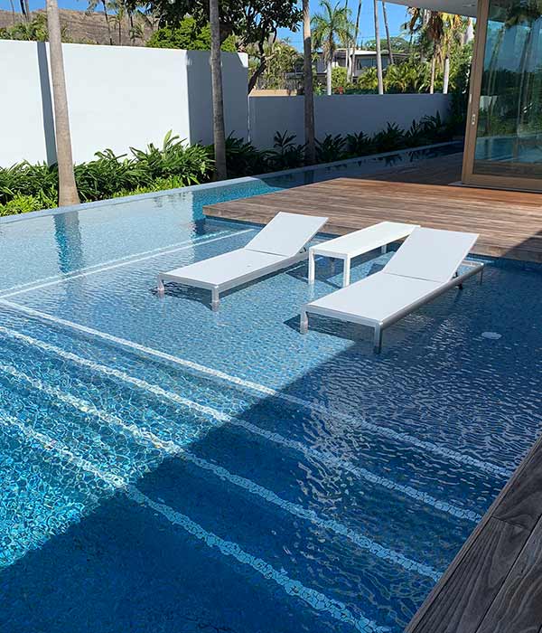 image of blue tile lunging swimming pool by Poseidon Pools Hawaii